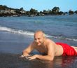 Man on Black sand beach