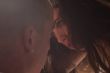 Loving couple in bright light looking into each others eyes