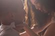 Loving couple in bright light passionately loving each other