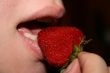 Mouth eat big mature strawberry