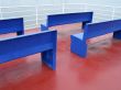 blue benches on red floor