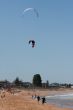 Kite Surfers On A Beach