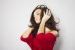 Young beautiful happy women listening music in headphones