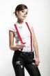 Photo of beautiful girl stretching suspenders