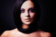 brunette girl posing on dark background