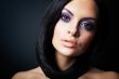 brunette girl posing on dark background