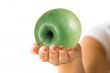 Green apple and hand
