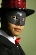 Masked performer portrait with top hat