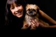 Smiling glaourgirl with puppy