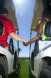 interracial golf couple holding hands