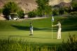 father and son on golf course