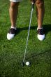 male golfer on putting green
