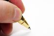 Hand and pen on the white paper