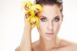 happy young woman with yellow flower