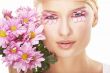 Girl wearing makeup made of flowers