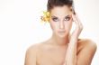 happy young woman with yellow flower