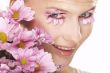 Girl wearing makeup made of flowers