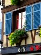 Window over  french cafe in Alsace