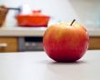 Rich apple on the kitchen desk