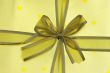 yellow ribbon with golden paper and golden hearts.