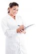 young female doctor writing on notepad