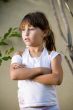 little girl with crossed arms looking side