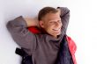 smiling young guy posing in sleeping bag