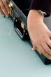 hands holding suitcase