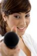 front view of female executive offering microphone