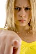 angry female pointing at camera