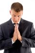 praying professional looking at camera