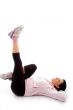 laying exercising woman on white background