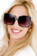 close up of smiling model wearing sunglasses