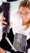 smiling employee showing phone receiver