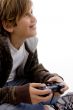 side view of glad young kid enjoying videogame