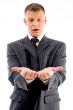 surprised businessman looking at his palms