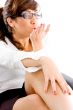 side pose of woman giving flying kiss