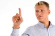 man looking at his finger