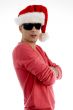 male with folded arms and wearing christmas hat
