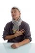 man with christmas hat putting hand on his chest