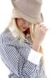 side view of young female holding hat