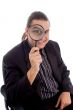 young investigator holding magnifier