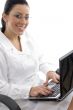 side view of smiling doctor working on laptop