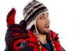 man wearing winter cap and jacket with a pointing