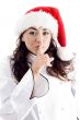 chef wearing christmas hat and shush with finger