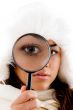 portrait of female holding magnifing glass