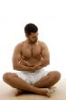 front view of man sitting with his legs crossed