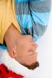 sleeping man with christmas hat and ear phones