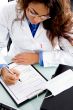  young doctor writing prescription