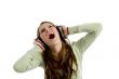 beautiful female rocking on listening music
